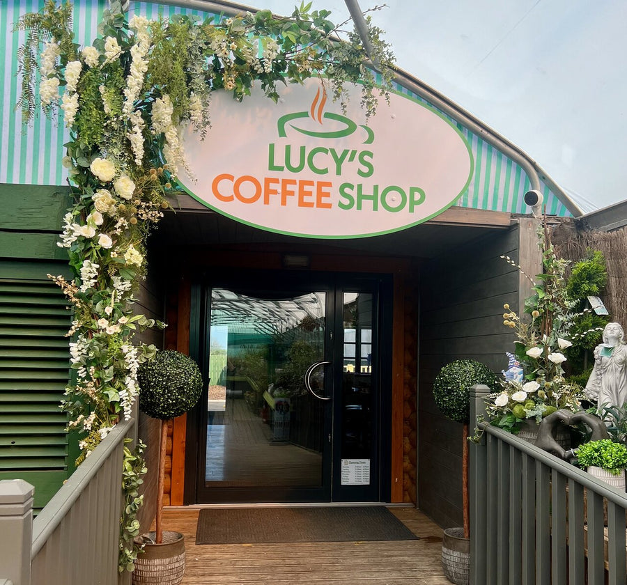Flower-decorated entrance to Lucy's Coffee Shop at Southwood Garden Centre