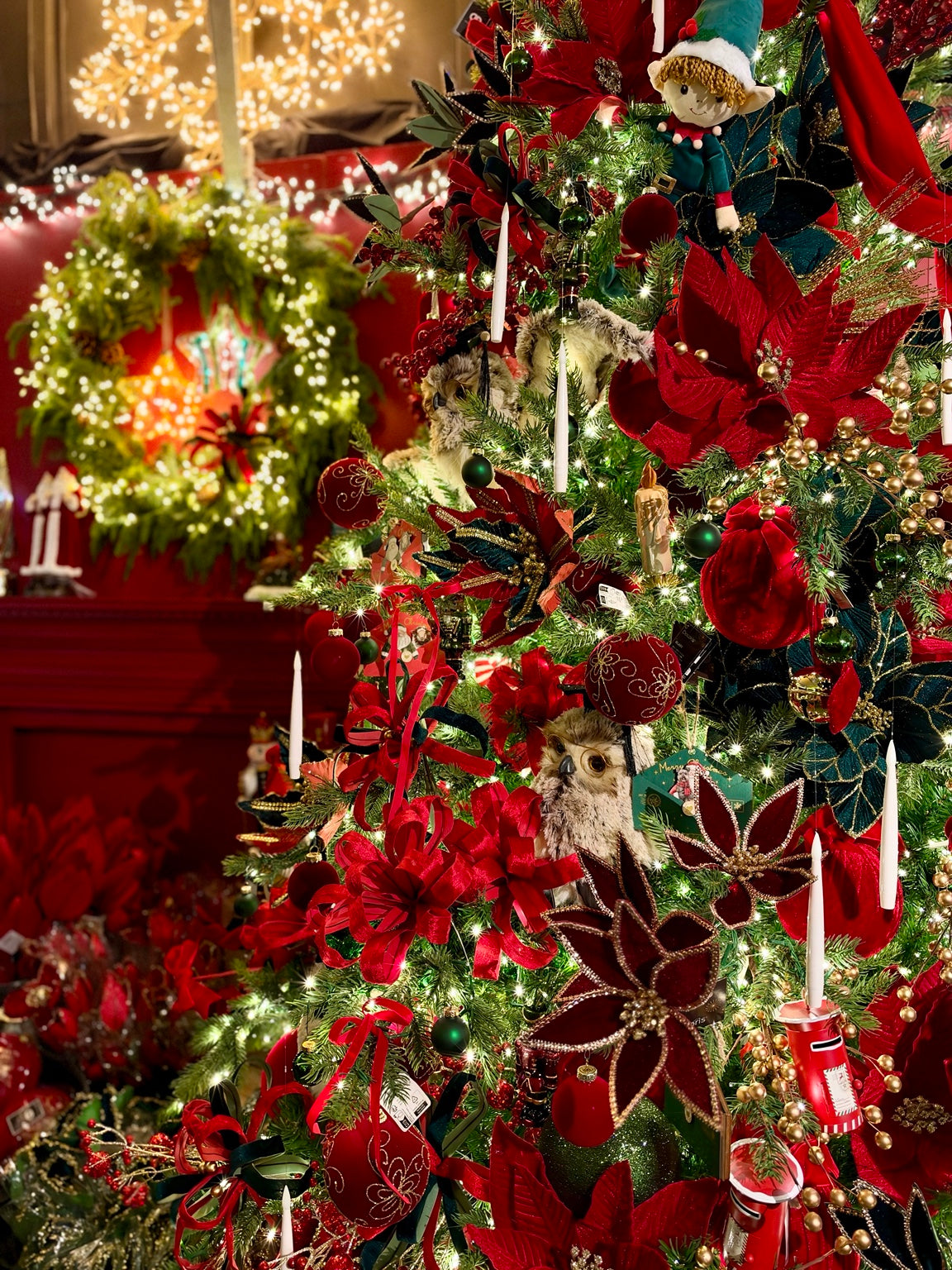 Luxury red and green decorated Christmas tree display at Southwood Garden Centre
